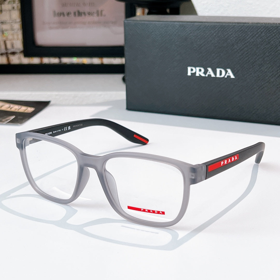 Prada glasses with light gray frames and clear lenses, red temple accent