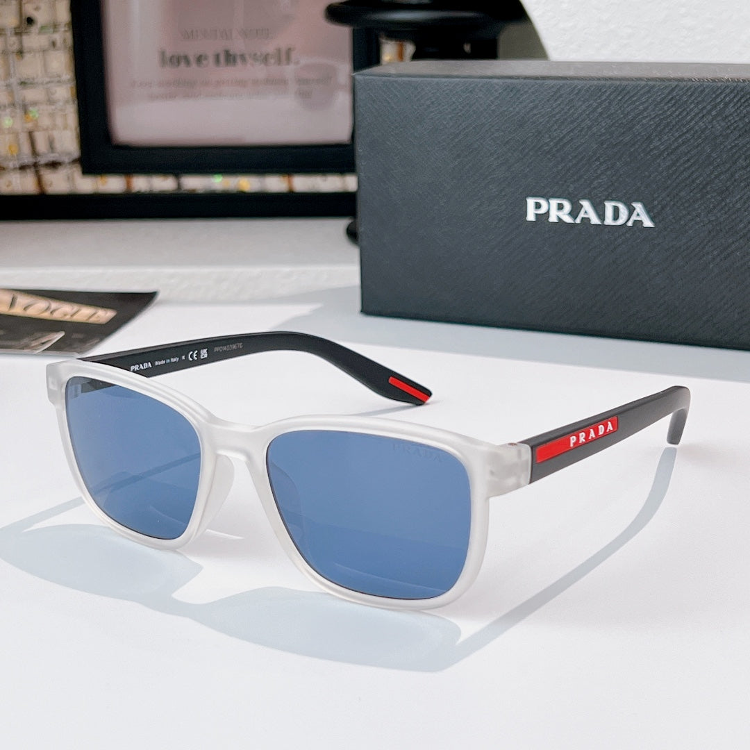 Prada glasses with white frames and blue tinted lenses, red logo temple detail