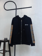 Navy zip-up hoodie with hood, front zipper and plaid side stripe sleeves.