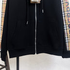 Black hooded zip-up hoodie with two front pockets and centered zipper