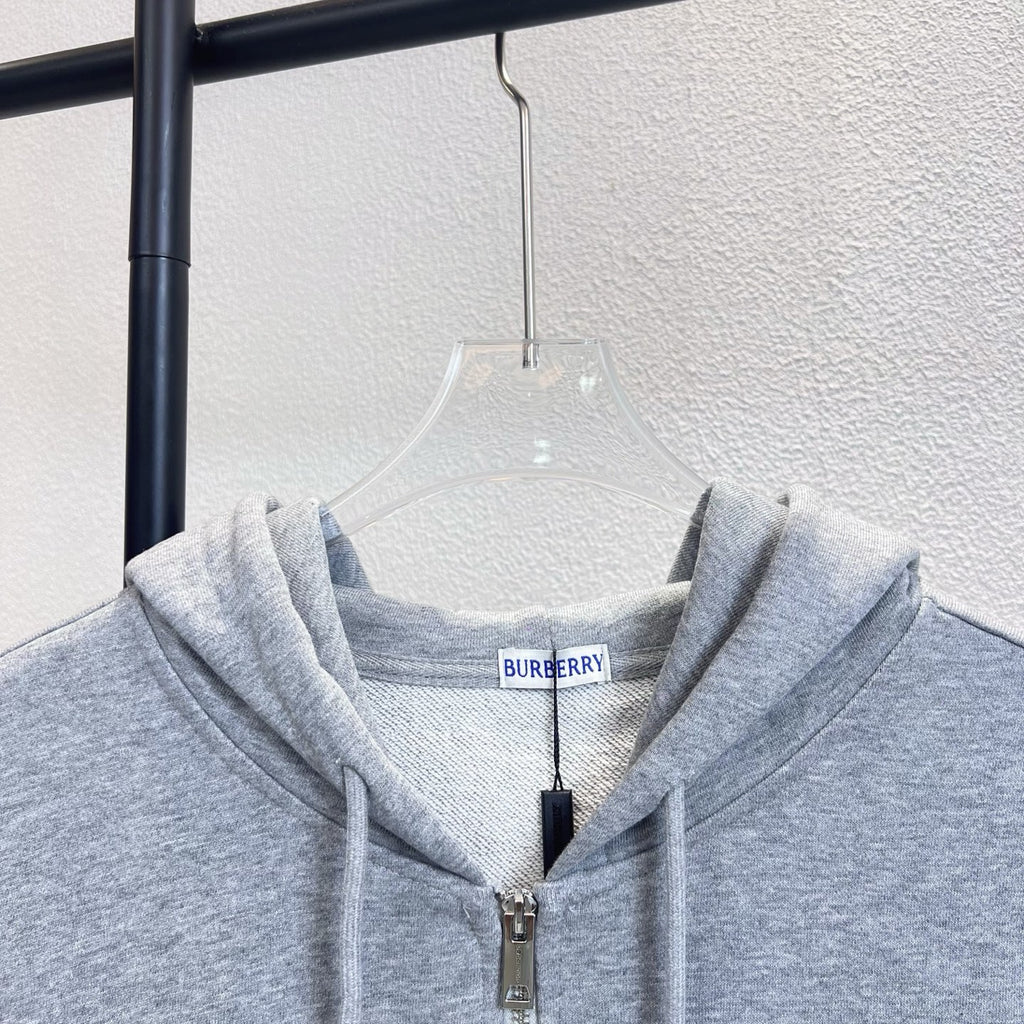 Gray zip hoodie collar with drawstring hood and front zipper; Burberry neck label.