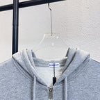 Gray zip hoodie collar with drawstring hood and front zipper; Burberry neck label.