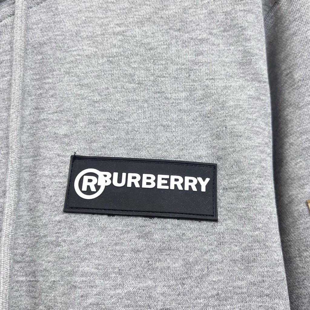 Gray hoodie chest logo patch reading RBURBERRY.