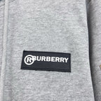 Gray hoodie chest logo patch reading RBURBERRY.