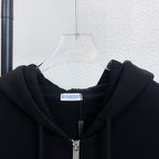 Black zip-up hoodie with hood and Burberry logo tag at neckline