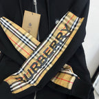 Black hoodie sleeve and hood panel with Burberry check pattern and logo print