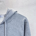 Gray hoodie shoulder and hood with drawstrings; Burberry label at neck.
