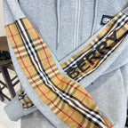 Light gray zip-up hoodie with front zipper and Burberry check-pattern panel