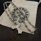 Silver-tone chain necklace with cross pendant and engraved tag detail