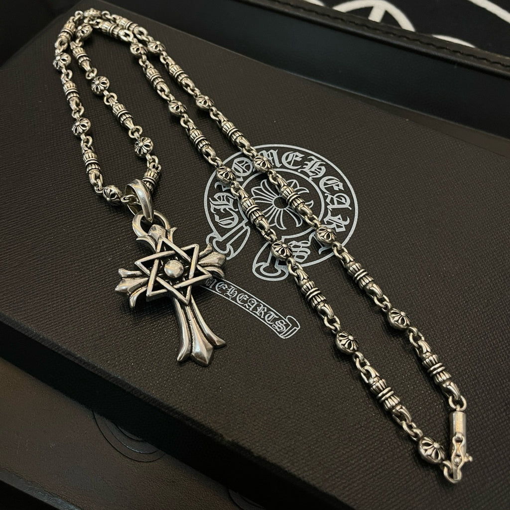 Silver-tone chain necklace set with cross star pendant and small bead-link accents