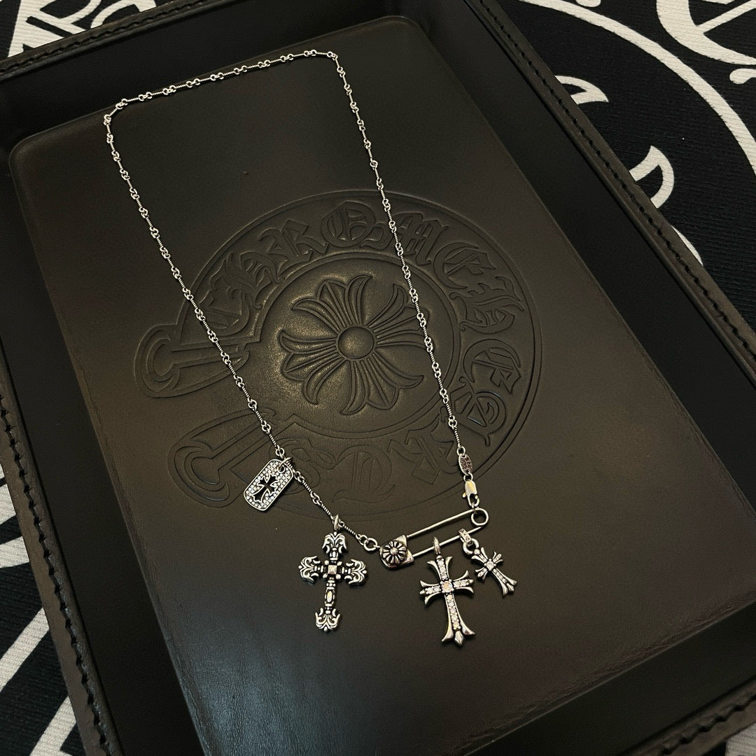 Silver-tone cross pendant necklace with small charm tag and hanging cross