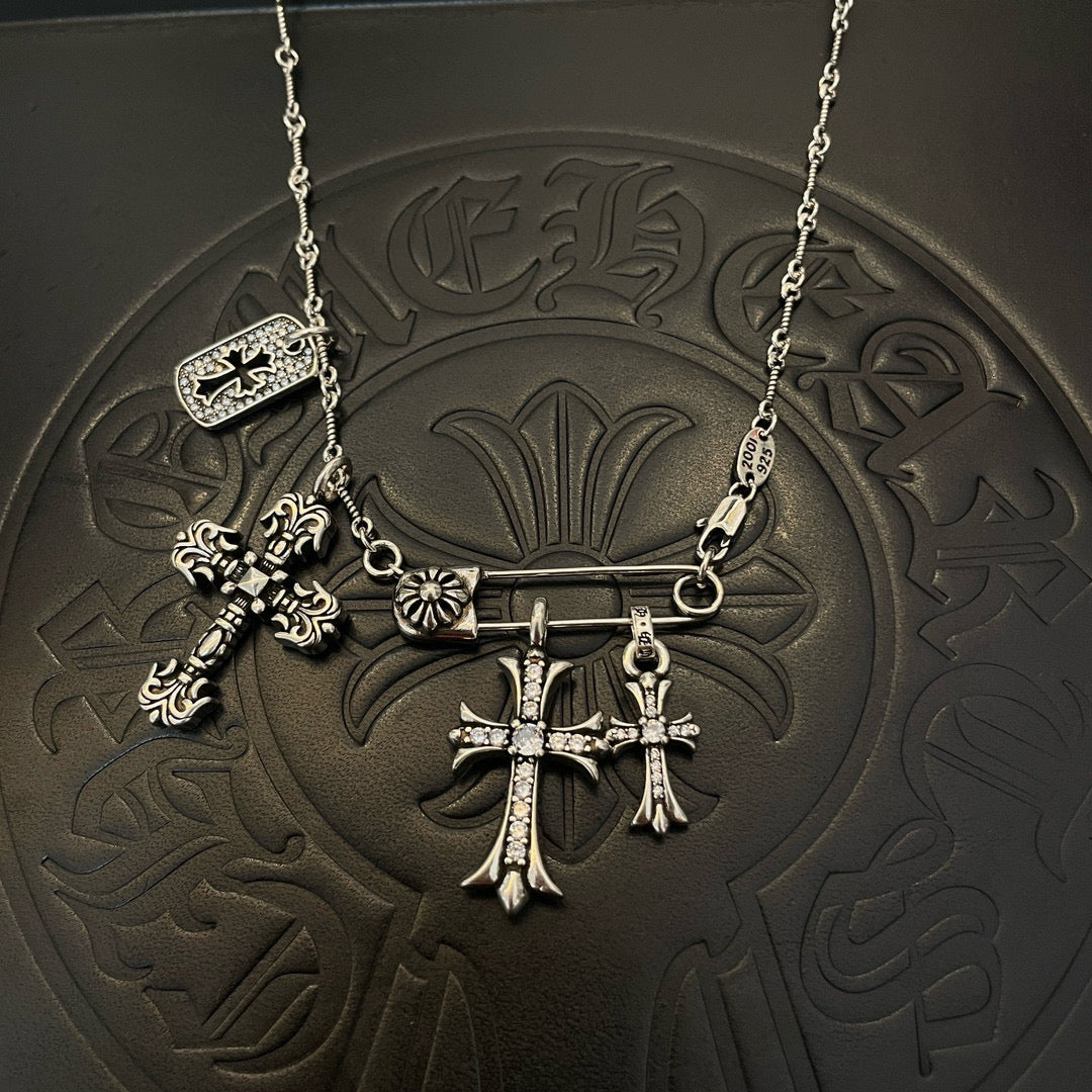 Silver-tone multi-cross pendant necklace with chain and hanging charms