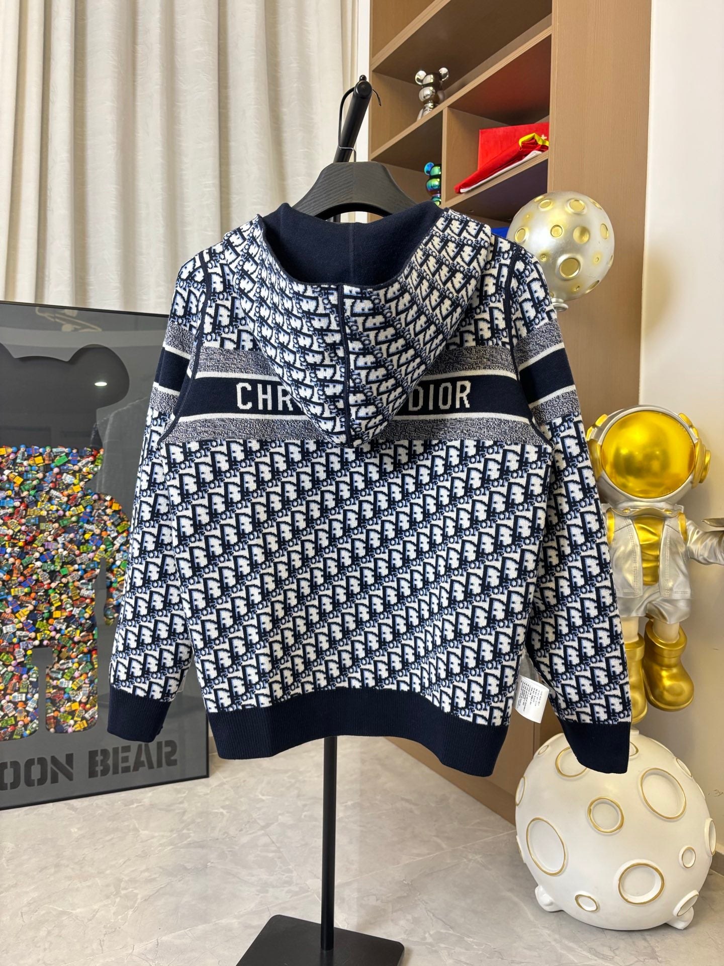 Dior hooded pullover with navy-and-white pattern, striped bands and logo stripe