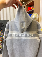 Gray hoodie back with hood and "CHRISTIAN DIOR" logo across the center