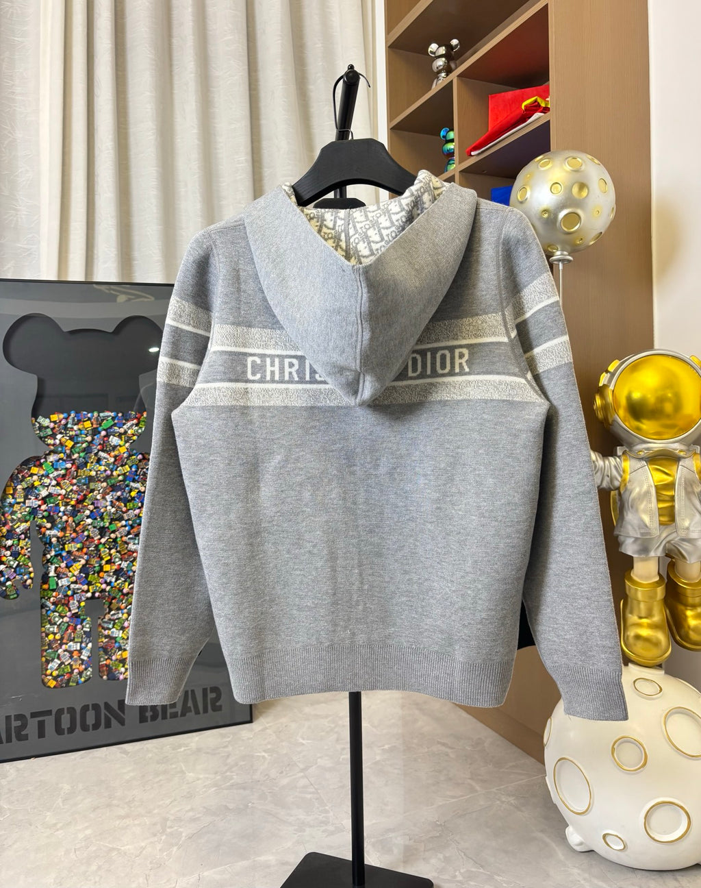Gray zip-up hoodie with hood and horizontal "CHRISTIAN DIOR" logo band