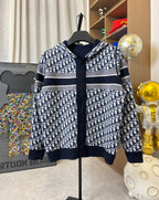 Dior hooded zip jacket with navy-and-white allover pattern, striped bands and hood