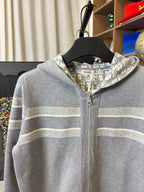 Gray zip-up hoodie with hood and light horizontal stripe detailing