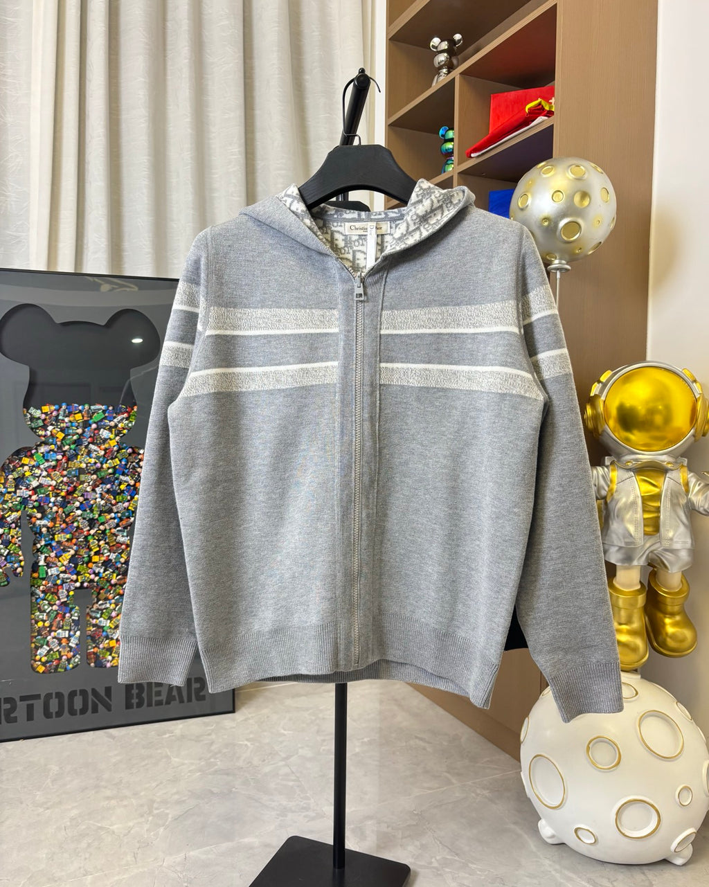 Gray zip-up hoodie with hood and light striped bands