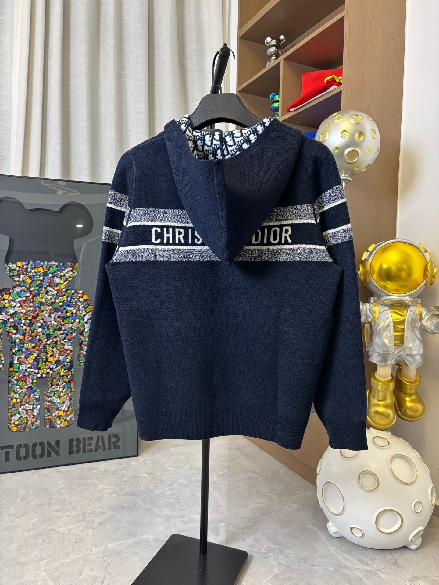 Dior hooded zip jacket in dark navy with “CHRIST” and “DIOR” chest lettering