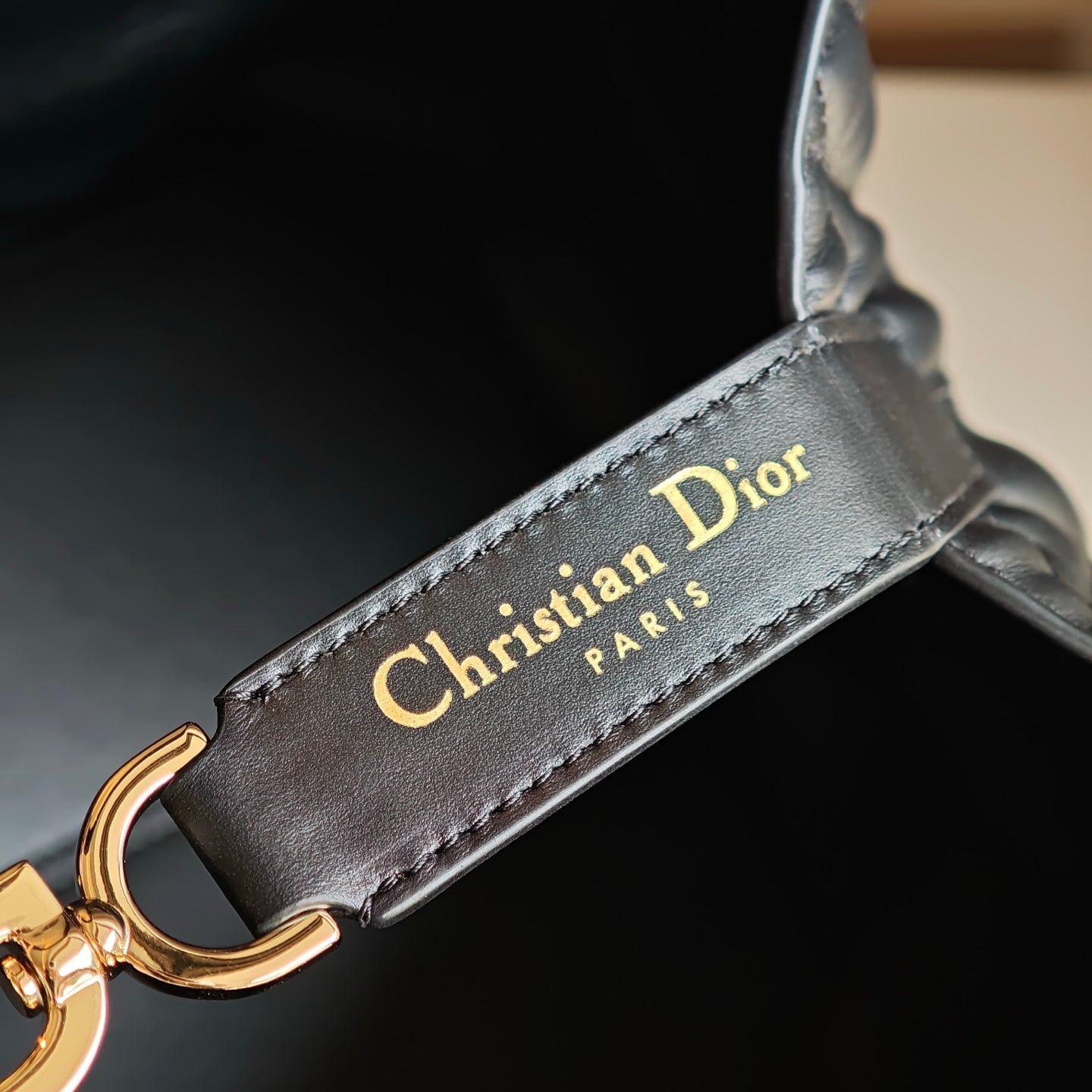 Christian Dior Paris strap patch with gold hardware, dark blue leather