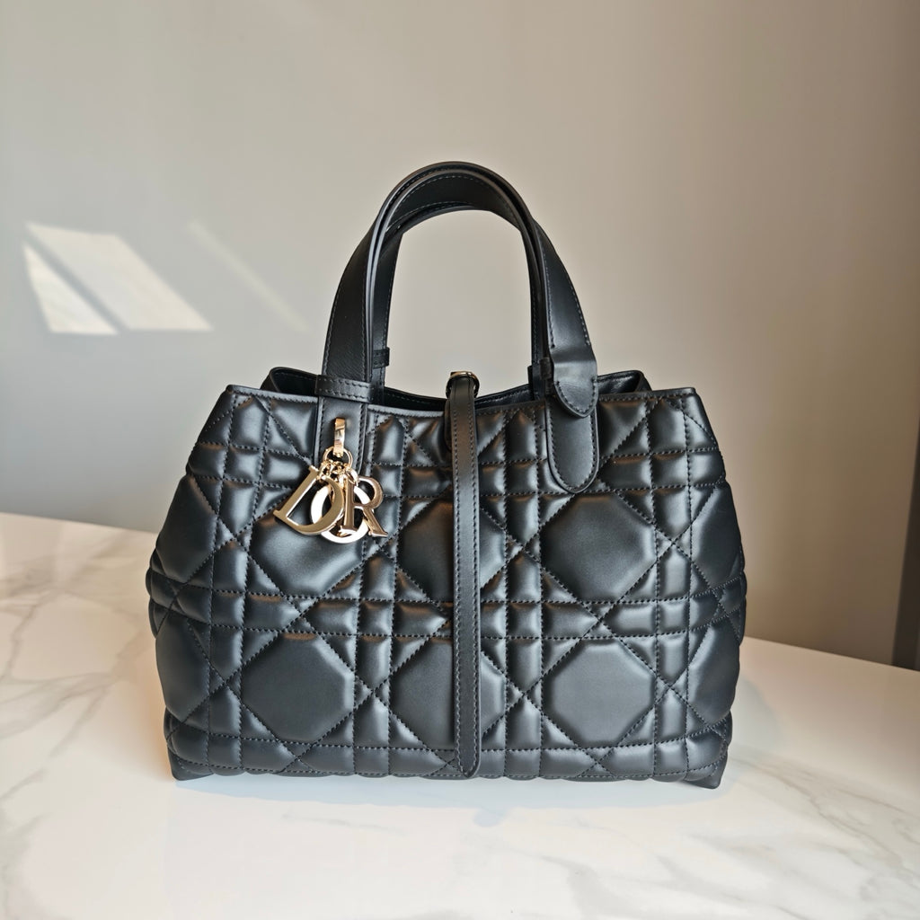 Dior quilted tote bag with gold D-R logo clasp and top handles, dark blue