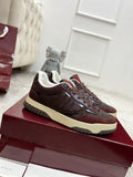 Gucci unisex sneaker in dark brown with cream sole and striped heel detail