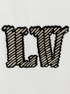 White Louis Vuitton T-shirt close-up of large embroidered LV letters