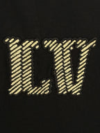 Louis Vuitton short-sleeve T-shirt detail: gold LV embroidery on black fabric