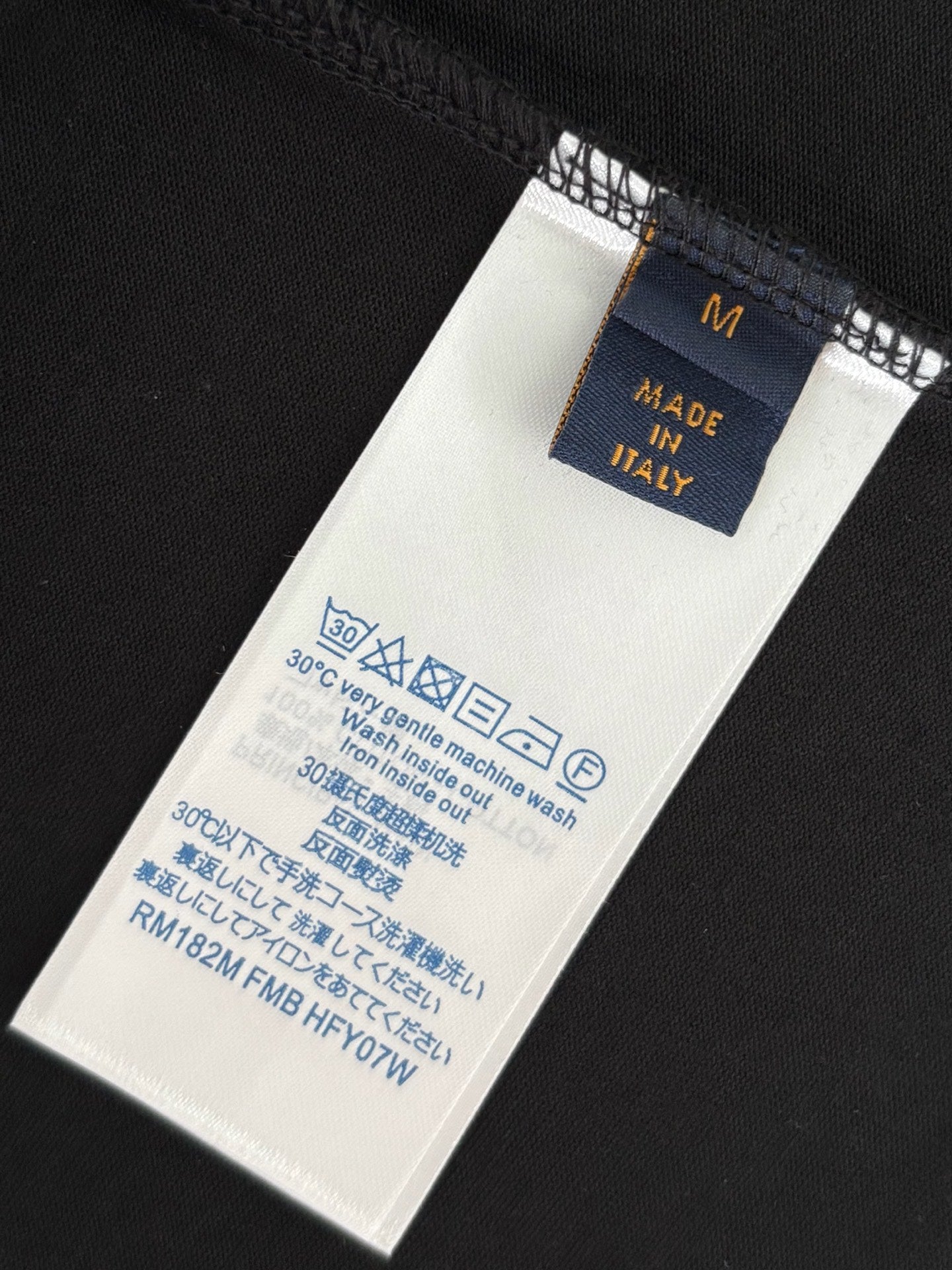 Louis Vuitton short-sleeve T-shirt size and care label on black fabric
