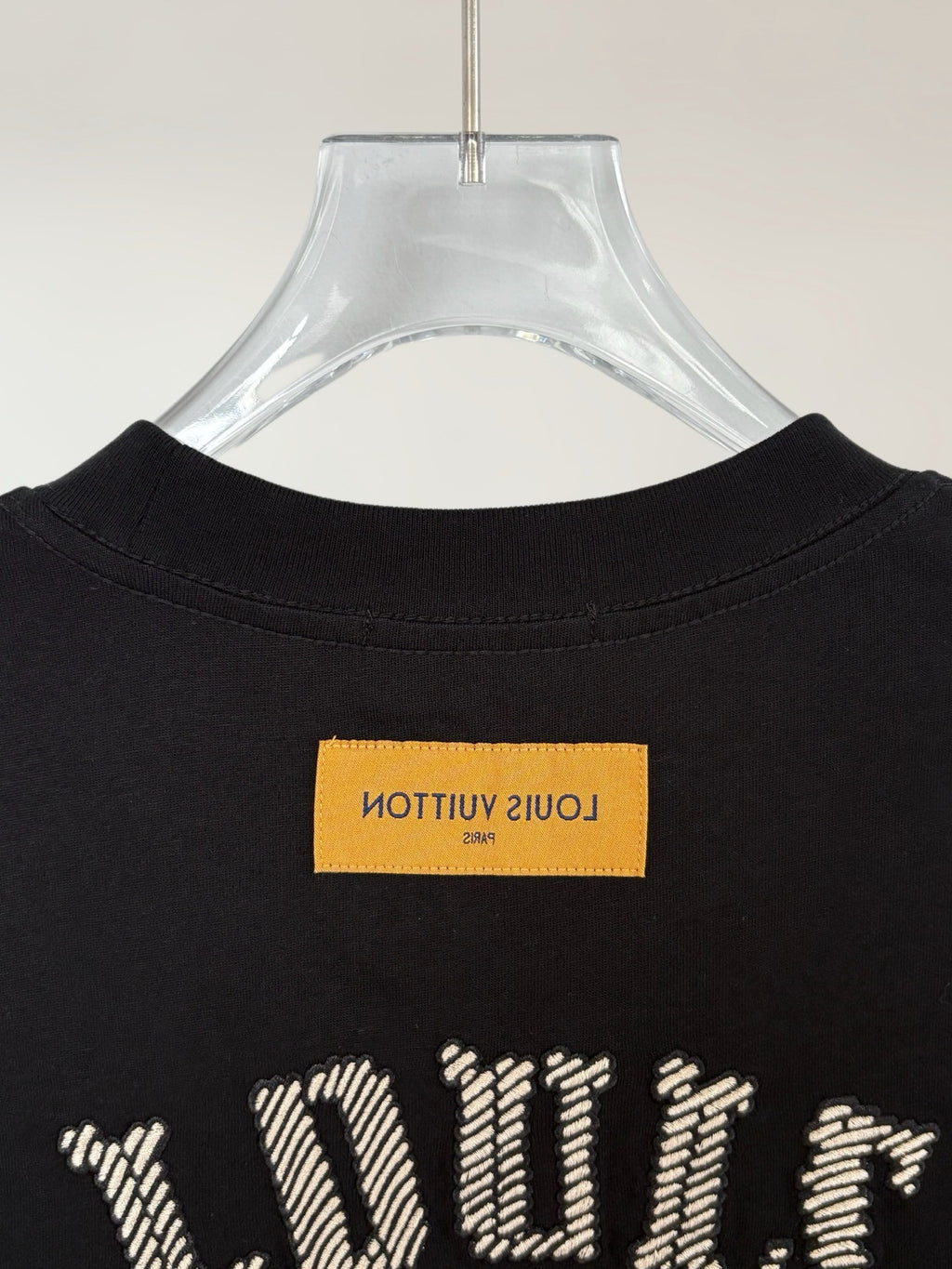 Louis Vuitton short-sleeve T-shirt back view in black with yellow label