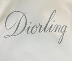 White fabric with 'Diorling' script print