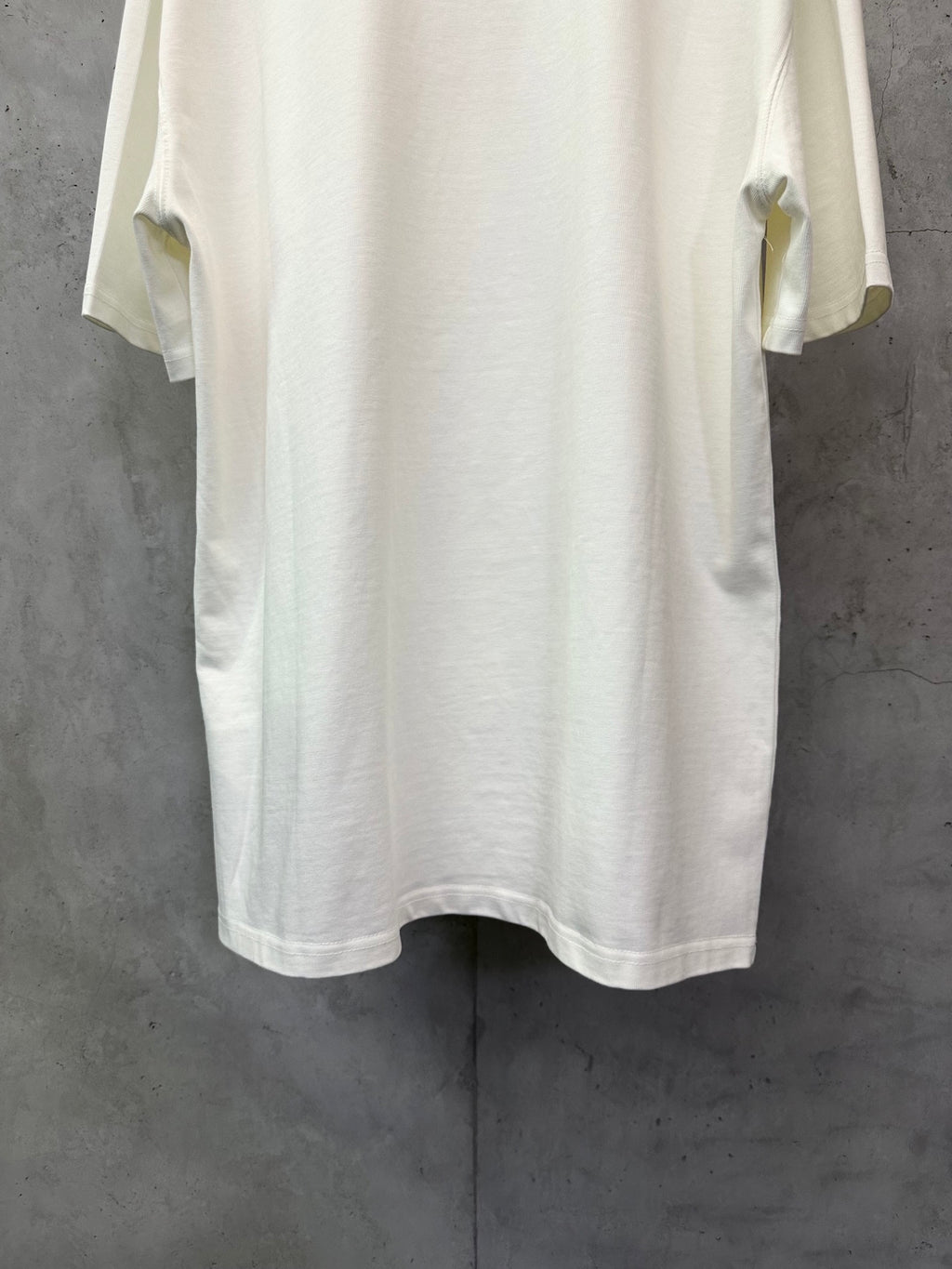 White short-sleeve T-shirt, back view with rounded hem