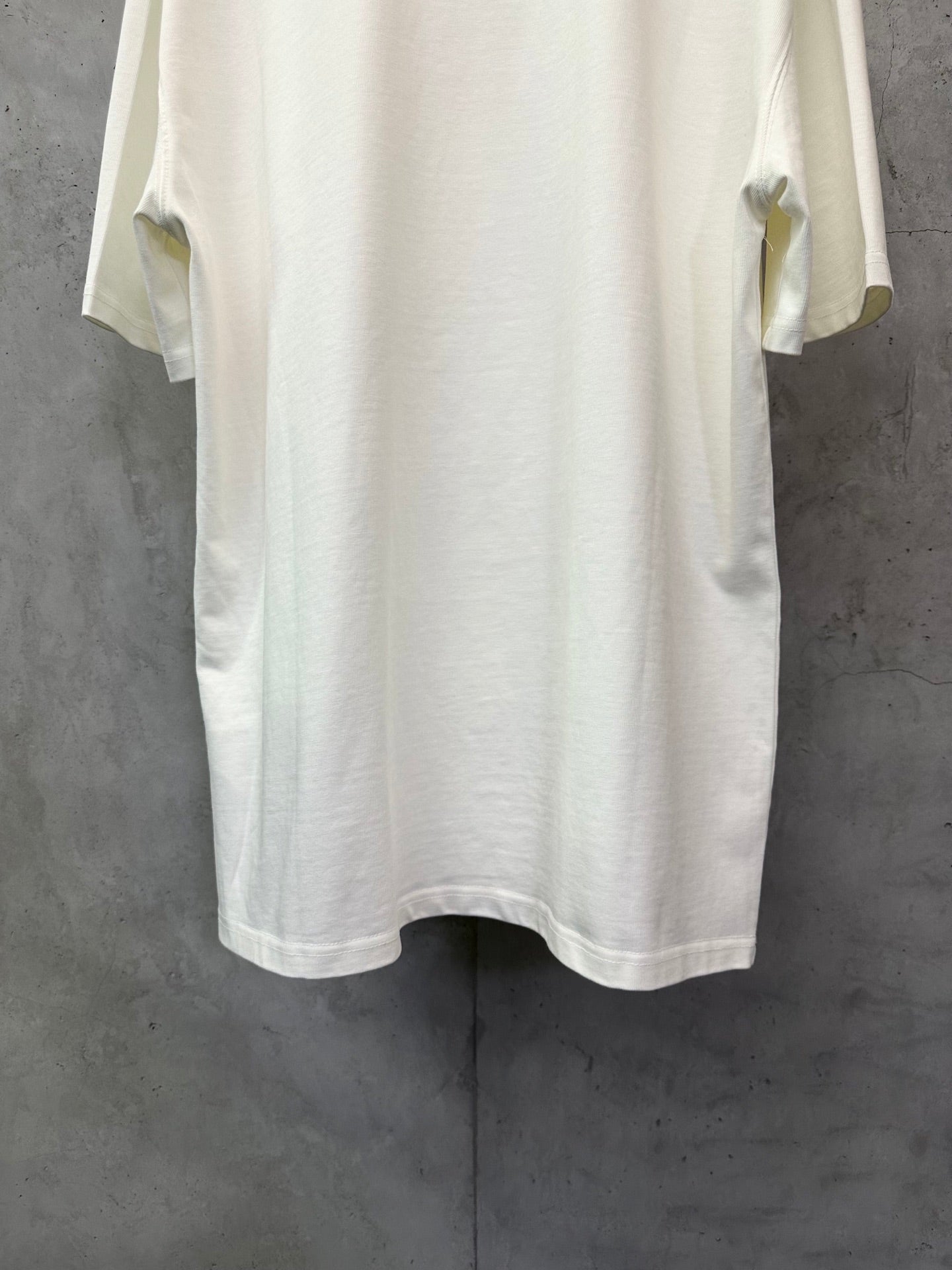 White short-sleeve T-shirt, back view with rounded hem