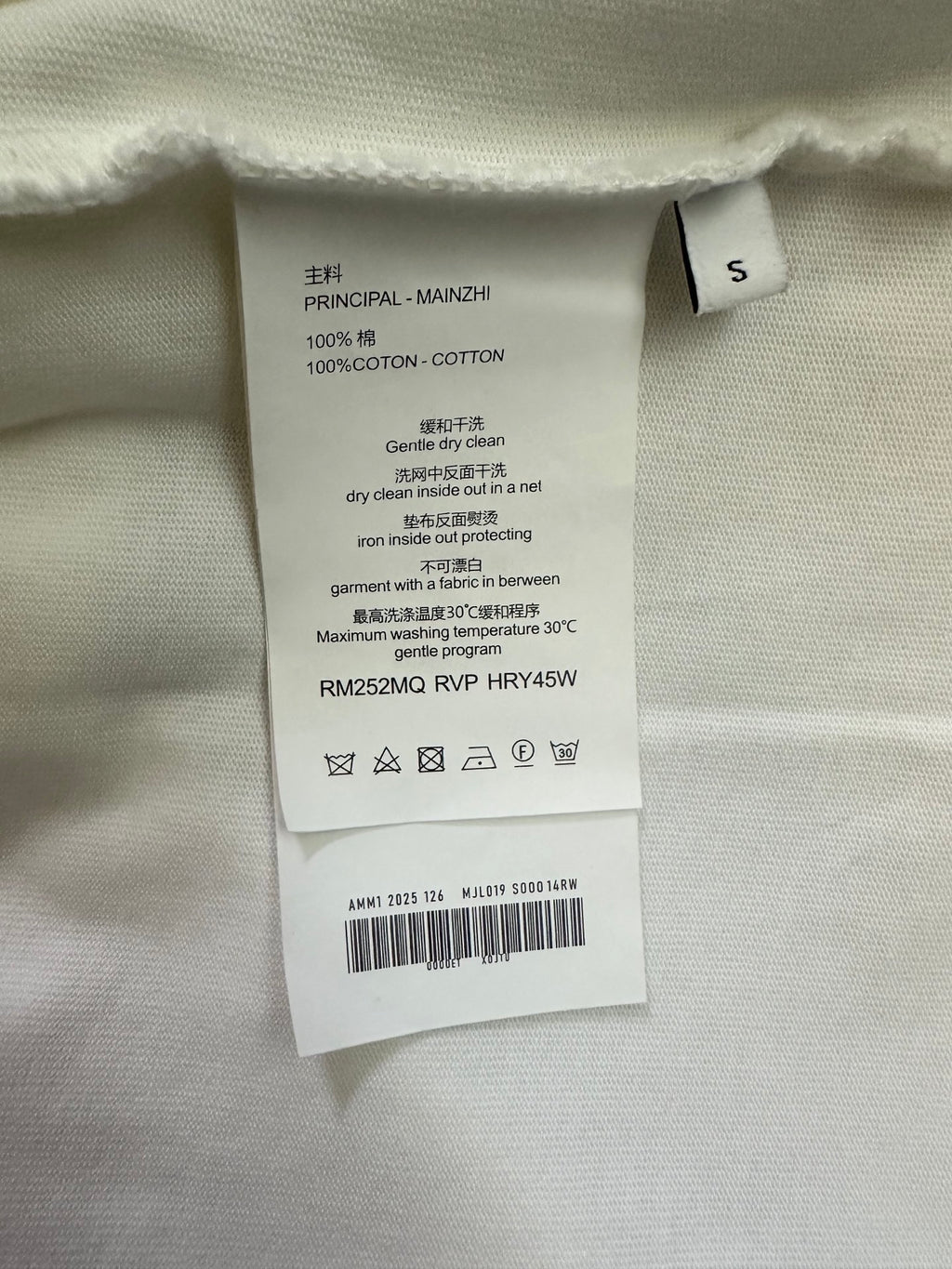 Inside care label: 100% cotton, size S, dry clean instructions