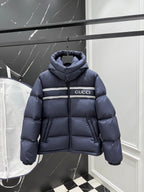 Dark blue puffer jacket with hood, full-zip front and Gucci logo stripe