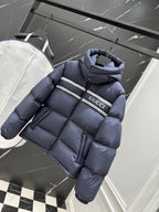 Dark blue puffer jacket with hood and Gucci logo band across chest
