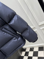 Dark blue puffer jacket sleeve and shoulder with striped Gucci logo band