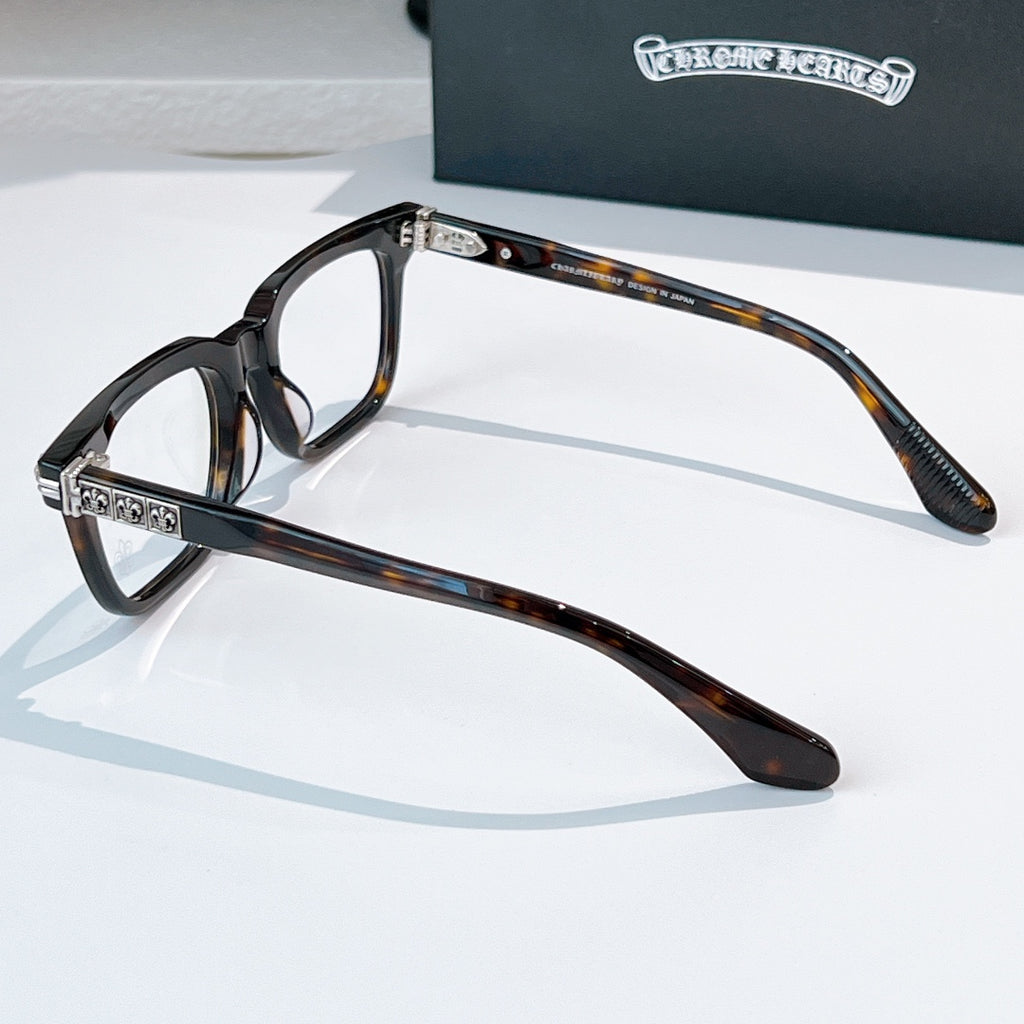 Tortoise-shell eyeglasses with square frames and silver-tone hinge detail