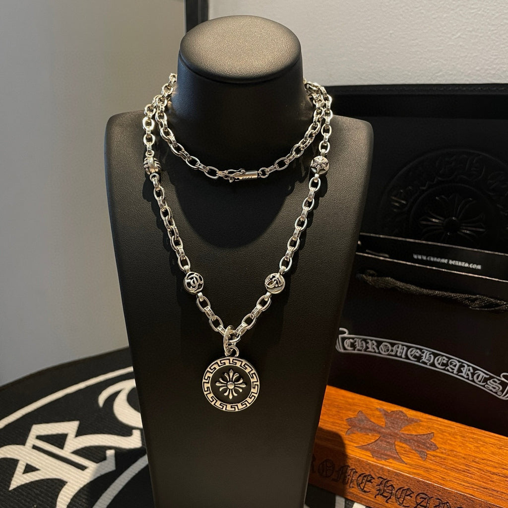 Silver-tone pendant necklace with round charm medallion and double chain layers