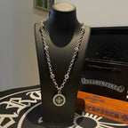 Silver-tone pendant necklace with round medallion and linked chain