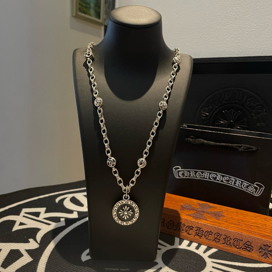 Silver-tone pendant necklace with round medallion and linked chain