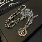 Silver-tone multi-chain pendant necklace with round sun medallion charm