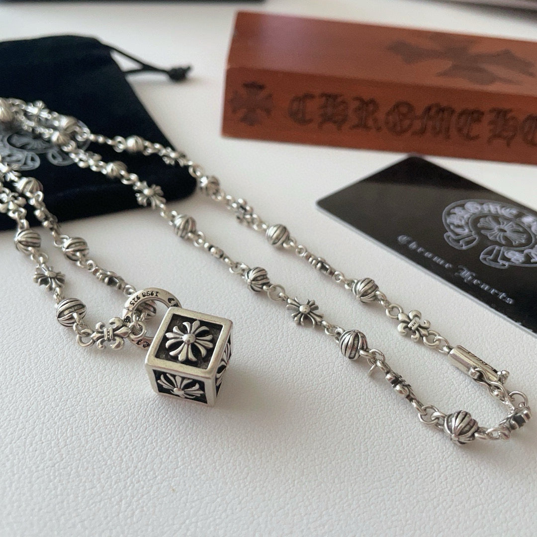 Silver-tone charm necklace set with square flower pendant and floral bead motifs