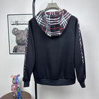 Dark navy hooded zip jacket with plaid-lined hood and long sleeves