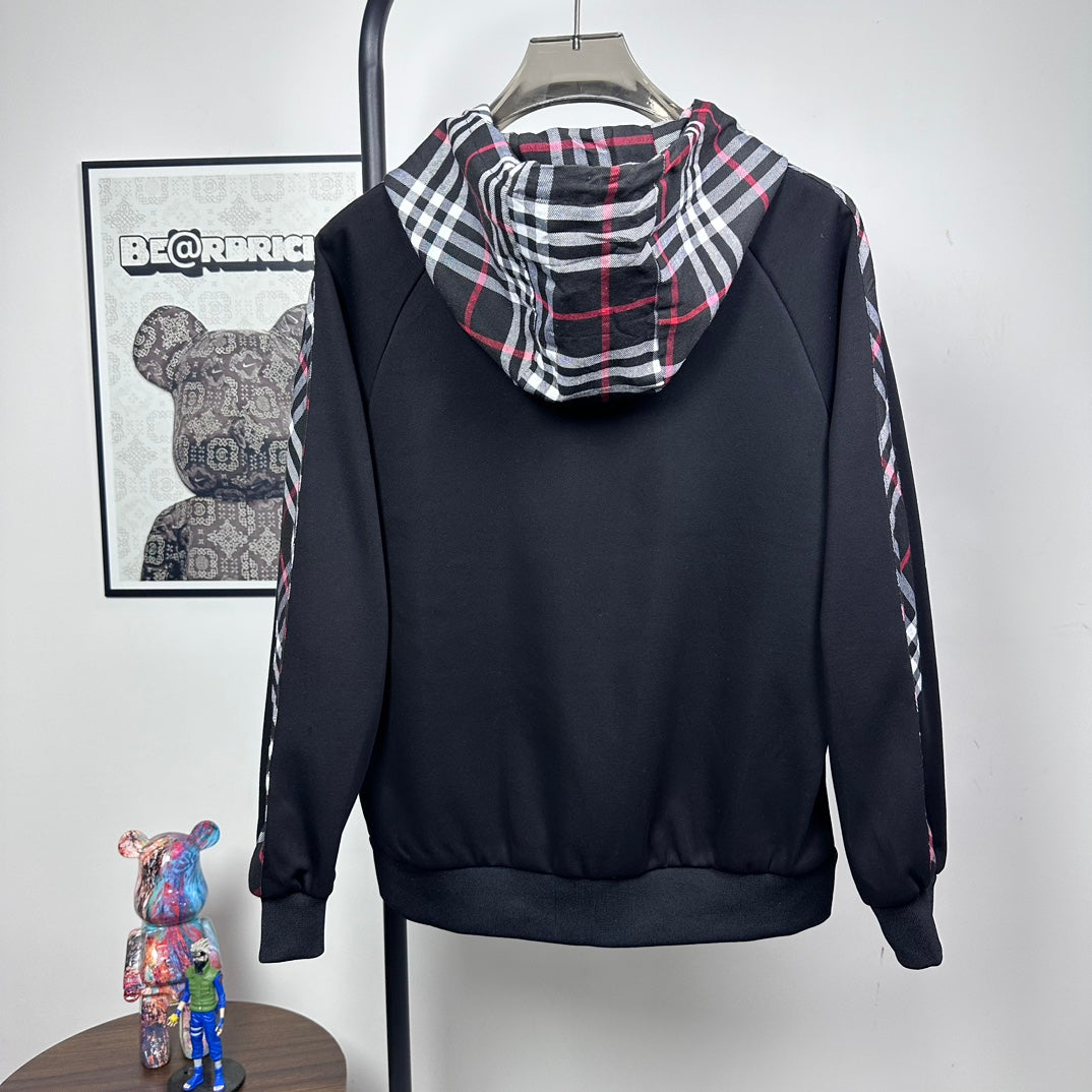 Dark navy hooded zip jacket with plaid-lined hood and long sleeves