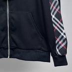 Dark navy zip jacket with front pocket seam and plaid sleeve panel