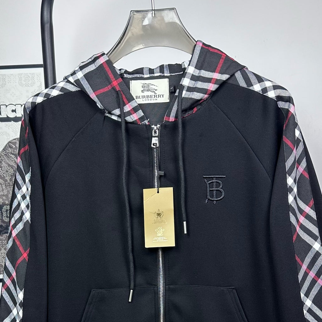 Dark navy hooded zip jacket with plaid hood, front zipper, and small logo patch