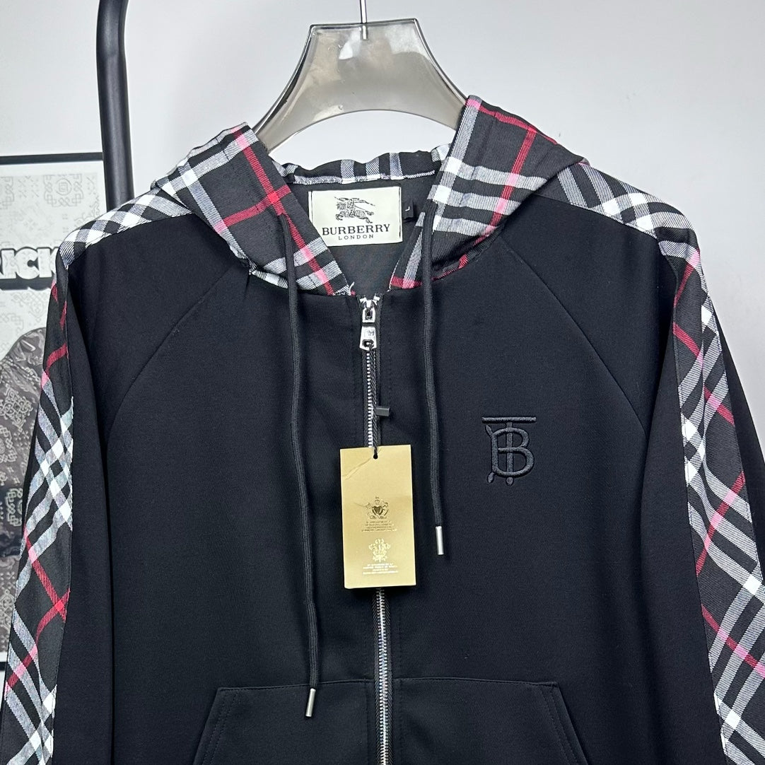Dark navy hooded zip jacket with plaid hood, front zipper, and small logo patch