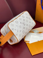 Louis Vuitton crossbody bag angled view with white monogram print and tan edge trim