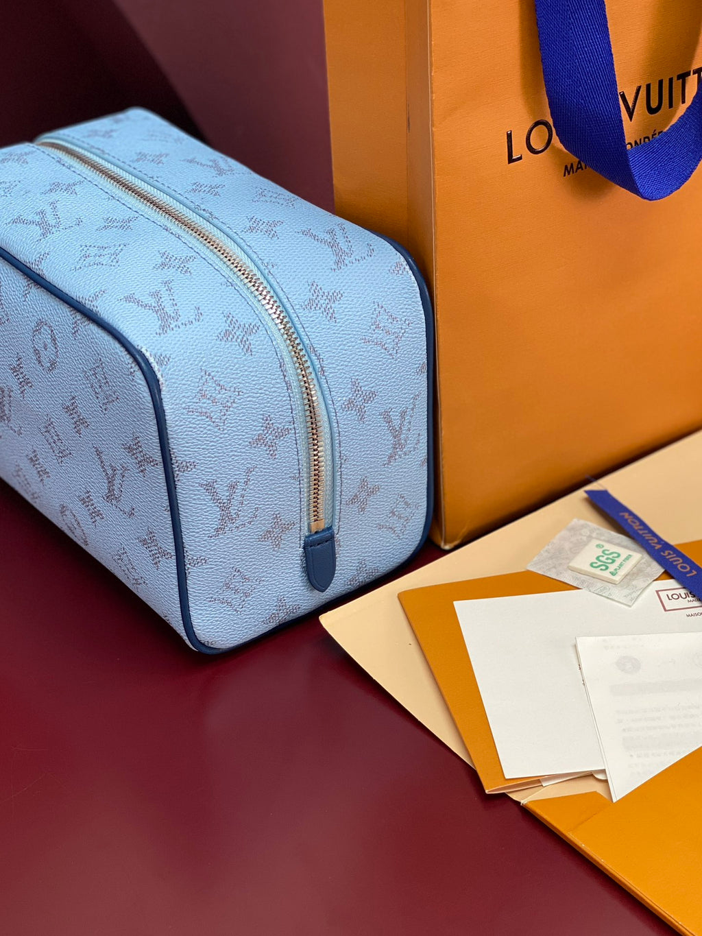 Louis Vuitton light blue monogram crossbody bag with side zipper and blue strap